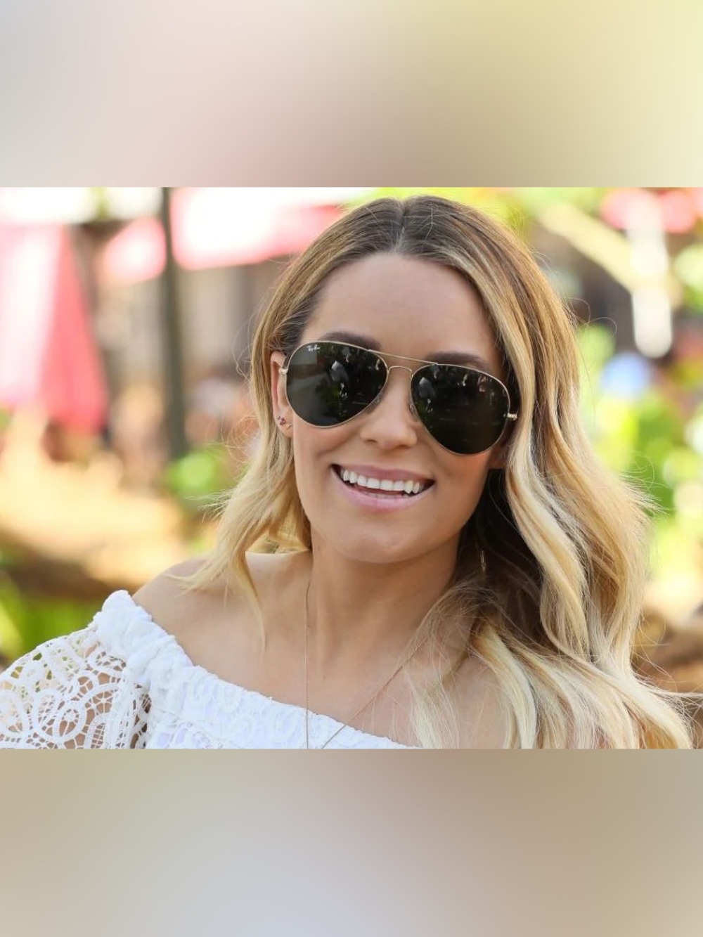 Ray-Ban black aviator sunglasses with gold and checkered interior pattern